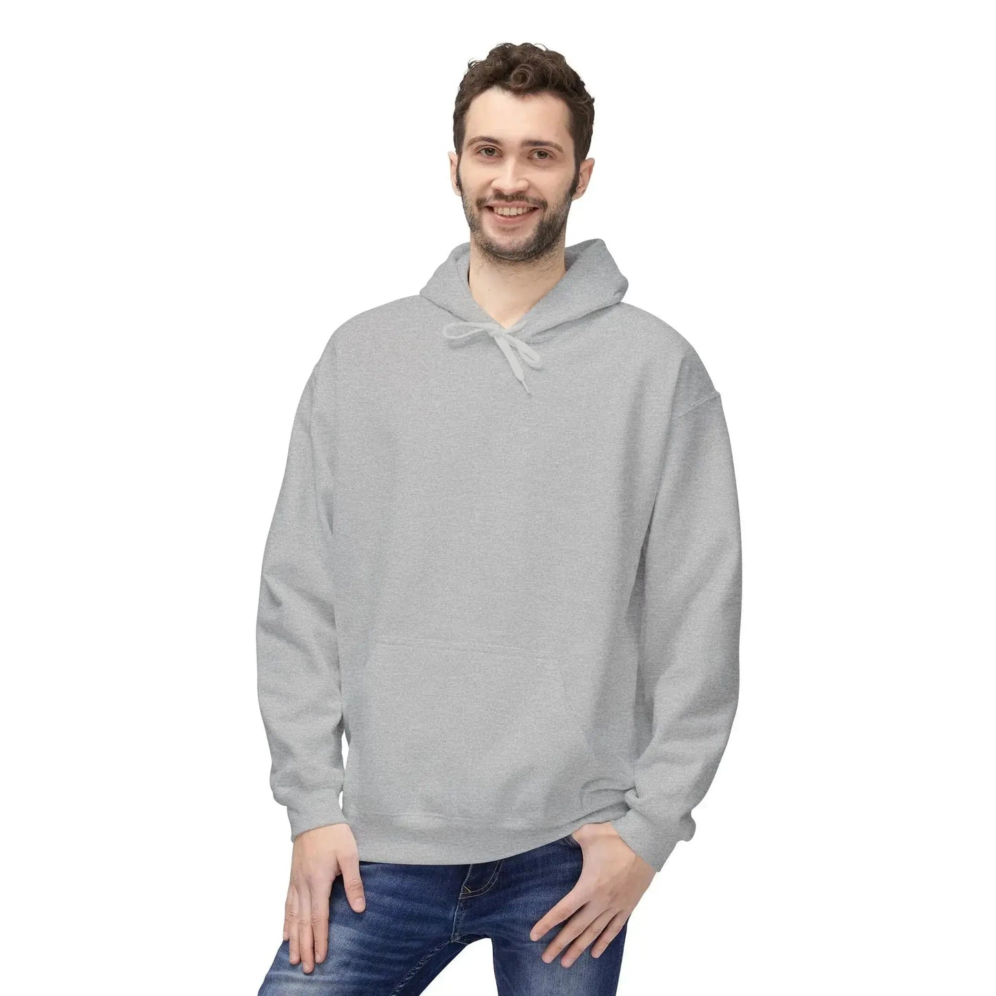 Smiling man wearing plain light gray hoodie and blue jeans, isolated on white background