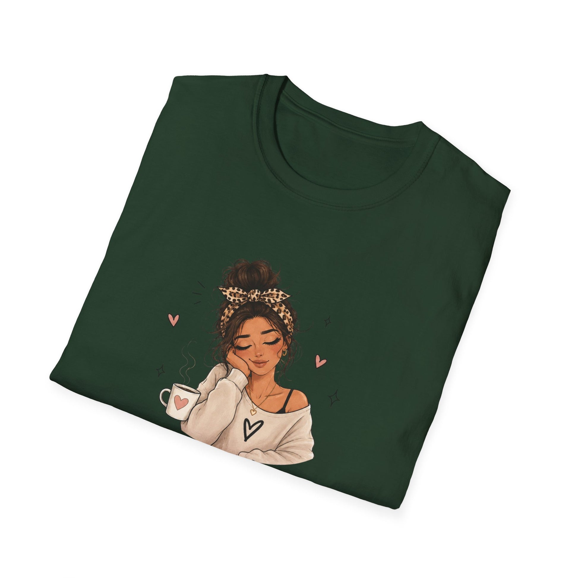 Folded green t-shirt with an illustration of a woman holding a coffee cup on a white background