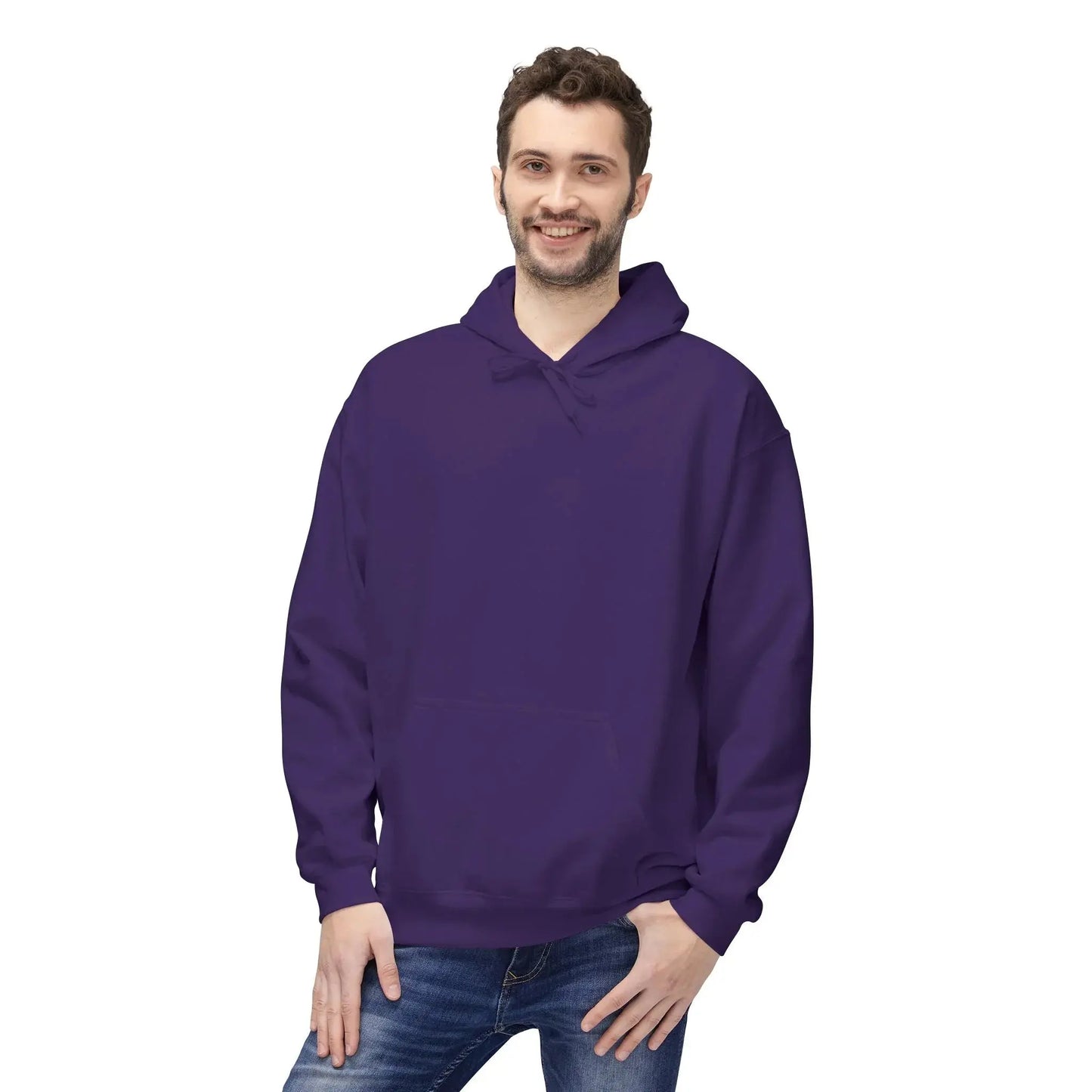 Smiling man wearing a plain purple hoodie and jeans on white background
